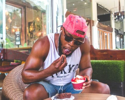 How to Increase Testosterone Naturally, a man eating ice cream