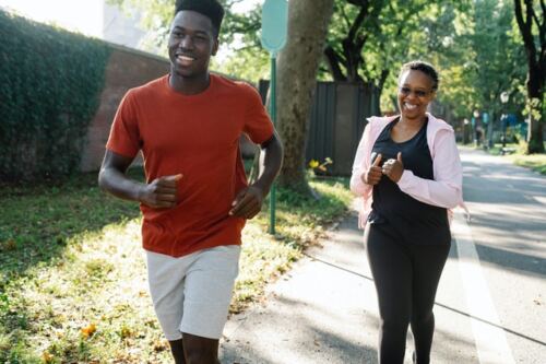 Benefits of regular exercise, a happy man and a woman running