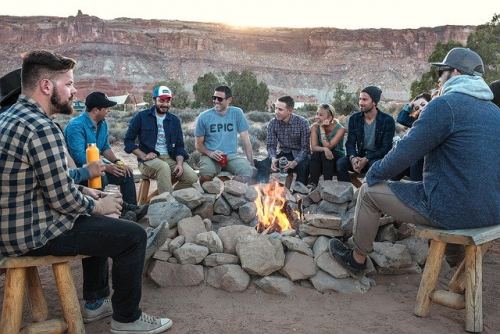 Where Is Testosterone Produced In Your Body, a large group of men chatting next to a campfire